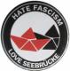 Zur Artikelseite von "Hate Fascism - Love Seebrücke", 37mm Button für 1,10 €
